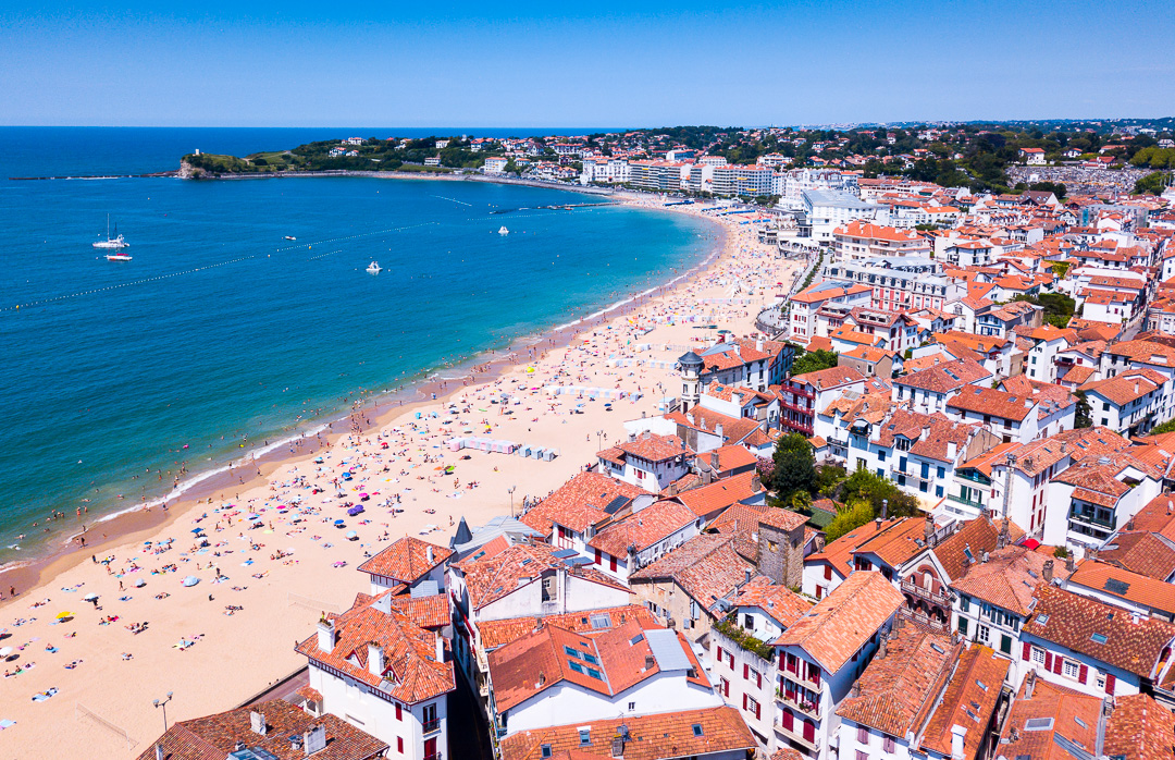 Hossegor & The Landes Coast: Aerial view of the sandy beach and red-roofed town of St-Jean-de-Luz | Simpson Travel